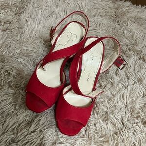 Red Jessica Simpson high heels.